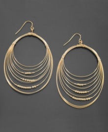 For the girl who always wants more. Get a little dressier with these gorgeous GUESS earrings featuring multiple wire hoops accented with tiny beads. Crafted in goldtone mixed metal. Approximate length: 3-3/4 inches. Approximate width: 1-1/2 inches. For the girl who always wants more. Get a little dressier with these gorgeous GUESS earrings featuring multiple wire hoops accented with tiny beads. Crafted in goldtone mixed metal. Approximate length: 3-3/4 inches. Approximate width: 1-1/2 inches.