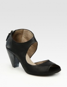 Edgy cutouts and an exposed back zipper define this Italian leather peep toe design. Stacked heel, 3 (75mm)Leather upperBack zipperLeather lining and solePadded insoleMade in ItalyOUR FIT MODEL RECOMMENDS ordering one size up as this style runs small. Edgy cutouts and an exposed back zipper define this Italian leather peep toe design. Stacked heel, 3 (75mm)Leather upperBack zipperLeather lining and solePadded insoleMade in ItalyOUR FIT MODEL RECOMMENDS ordering one size up as this style runs small.