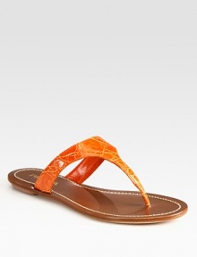 Genuine crocodile flat thong sandal with a leather footbed. Crocodile upperLeather lining and soleMade in ItalyOUR FIT MODEL RECOMMENDS ordering true size. Genuine crocodile flat thong sandal with a leather footbed. Crocodile upperLeather lining and soleMade in ItalyOUR FIT MODEL RECOMMENDS ordering true size.