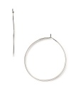 A striking yet slim silhouette makes these classic hoop earrings feminine and refined. From MICHAEL Michael Kors.