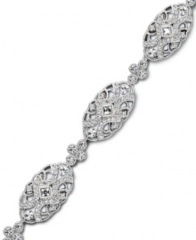 Sparkling style with a hint of vintage inspiration. Eliot Danori's stunning bracelet features swirls of round and square-cut crystal in a chic oval pattern. Set in silver tone mixed metal. Approximate length: 7-1/4 inches. Sparkling style with a hint of vintage inspiration. Eliot Danori's stunning bracelet features swirls of round and square-cut crystal in a chic oval pattern. Set in silver tone mixed metal. Approximate length: 7-1/4 inches.
