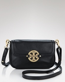 A bright gold tone logo gleams on this petite leather bag, featuring a removable crossbody strap. By Tory Burch. A bright gold tone logo gleams on this petite leather bag, featuring a removable crossbody strap. By Tory Burch.