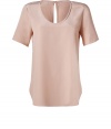 A soft nude hue and delicate washed silk inform this chic and versatile tee from Joseph - Scoop neckline, short sleeves, slit at nape with hidden hook closure, shirttail hemline - Loose fit - Wear with leather leggings and ankle boots, or tucked into a pencil skirt with heels