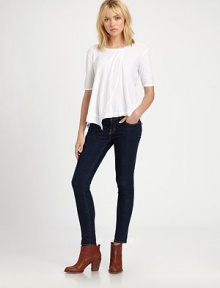 Crisp cotton tee styled with dropped shoulders, elbow-length sleeves and an asymmetrical hem. RoundneckDropped shouldersElbow-length sleevesAsymmetrical hemCottonMachine washMade in USAModel shown is 5'10 (177cm) wearing US size Small.