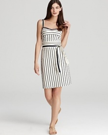 Anchor in the nautical mood of the moment with this Tory Burch dress. Crisp navy stripes elongate a polished cream sheath for a timeless take on the trend. Anchor in the nautical mood of the moment with this Tory Burch dress. Crisp navy stripes elongate a polished cream sheath for a timeless take on the trend.