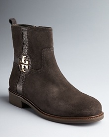 The classic chukka bootie goes glam as Tory Burch adds her hallmark gold logos to trusty standbys. The classic chukka bootie goes glam as Tory Burch adds her hallmark gold logos to trusty standbys.
