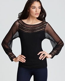 Exquisite, feminine details enrich this sassy sheer top by GUESS. Exquisite, feminine details enrich this sassy sheer top by GUESS.