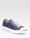 The classic lace-up style in soft canvas is sunwashed for a broken-in look. Padded insole Rubber sole Imported