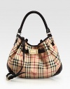 A slouchy, versatile shape featuring the signature Burberry check on smooth PVC with sleek leather trim. Leather top handle, 6½ dropAdjustable detachable leather shoulder strap, 19¾-23½ dropMagnetic snap closureOne inside zip pocketTwo inside open pocketsCotton lining14½W X 12H X 3½DImported