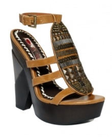 Hippie chic gone wild: The Annisette platform sandals by Two Lips are adorned with retro-inspired beads and studs at the oval vamp. Take your boho look to new heights with the chunky platform. Hippie chic gone wild: The Annisette platform sandals by Two Lips are adorned with retro-inspired beads and studs at the oval vamp. Take your boho look to new heights with the chunky platform.