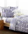 The Sakura duvet cover set from Style&co. presents a chic floral cut-out over soft purple with detailed green line embroidery. Digital purple droplets on the reverse create effortless charm, fit for the modern bedroom.