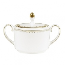 Rings of gold adorn fine white bone china with the lustrous shine of a wedding band. White bone china features two different border trims of gold, a wide corded border of textured grosgrain ribbon on some pieces, a narrow edge on others. Rings of gold adorn fine white bone china with the lustrous shine of a wedding band. White bone china features two different border trims of gold, a wide corded border of textured grosgrain ribbon on some pieces, a narrow edge on others.