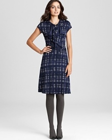 A study in classic feminine style, this Tory Burch dress flaunts a charming plaid print and a delicately ruffled front for effortless polish. Just add a dash of pearls and prepare to head the fashion class. A study in classic feminine style, this Tory Burch dress flaunts a charming plaid print and a delicately ruffled front for effortless polish. Just add a dash of pearls and prepare to head the fashion class.