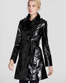 Stand out and shine on the most inclement days in a glossy Via Spiga trench coat, detailed with military-inspired accents for a dose of cool. Stand out and shine on the most inclement days in a glossy Via Spiga trench coat, detailed with military-inspired accents for a dose of cool.