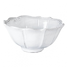 Handmade and inspired by the maestro artisan's family heirloom dinnerware, this ceramic serving bowl makes a rustically sophisticated dining statement. Handmade and inspired by the maestro artisan's family heirloom dinnerware, this ceramic serving bowl makes a rustically sophisticated dining statement.