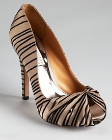 Badgley Mischka makes a striped statement with the Ryba pumps, boasting a flocked texture and a knotted peep toe. Badgley Mischka makes a striped statement with the Ryba pumps, boasting a flocked texture and a knotted peep toe.