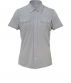 Stylish shirt in fine, pure pale grey cotton - A chic, modern hybrid of the classic polo and the traditional button down in an ultra-soft, summer weight material - Small collar and short sleeves - Full button placket and two flap pockets at chest - Slim, straight cut - Casually cool, perfect for pairing with jeans, chinos and shorts