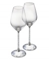 Add a touch of brilliant sparkle to your entertaining style with this set of red wine glasses. Shown at left. The bowls' classic lines and stems filled with glimmering Swarovski crystals combine for a sophisticated sensibility. Each measures 8-7/8 H x 3 D.