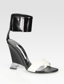 Modern leather wedge design finished with a snake-print leather strap. Lacquered wedge, 4½ (115mm)Snake-print leather and leather upperLeather solePadded insoleMade in ItalyOUR FIT MODEL RECOMMENDS ordering true size. Modern leather wedge design finished with a snake-print leather strap. Lacquered wedge, 4½ (115mm)Snake-print leather and leather upperLeather solePadded insoleMade in ItalyOUR FIT MODEL RECOMMENDS ordering true size.