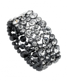 Add icy sparkle to a casual, corporate or cocktail look with this crystal-accented bracelet by GUESS. Crafted in hematite-plated mixed metal. Stretches to fit wrist. Approximate diameter: 2-1/4 inches. Add icy sparkle to a casual, corporate or cocktail look with this crystal-accented bracelet by GUESS. Crafted in hematite-plated mixed metal. Stretches to fit wrist. Approximate diameter: 2-1/4 inches.