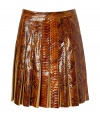 The ultimate showstopper! This ultra-luxe python and suede pleated skirt from Salvatore Ferragamo begs to be shown off in style - Fitted waist, allover pleating, concealed side zip closure, made with supple suede and glossy python - Flared silhouette - Wear with a cashmere turtleneck, a neutral-hued cape, and classic pumps