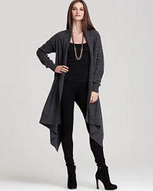 Cinched with a textured belt or worn effortlessly undone, this DKNY cardigan elongates the silhouette with flowing length and an asymmetric hem. Cinched with a textured belt or worn effortlessly undone, this DKNY cardigan elongates the silhouette with flowing length and an asymmetric hem.