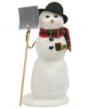 Paving the way for holiday guests, this Byers' Choice snowman carries a shovel in one hand and a corn cob-esque pipe in the other. His pristine snow glitters beneath a plaid scarf.