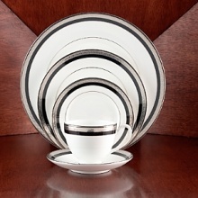Intricately textured platinum rings on pure white china paired with the fashionably modern look of ebony creates a new sophistication for your table. Intricately textured platinum rings on pure white china paired with the fashionably modern look of ebony creates a new sophistication for your table.