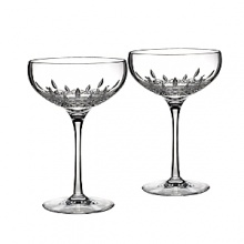 Exuding classic glamour, the Lismore Essence Collector's Edition saucer champagne glass features the Lismore pattern's diamond-like facets. Exuding classic glamour, the Lismore Essence Collector's Edition saucer champagne glass features the Lismore pattern's diamond-like facets.