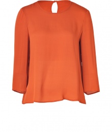 A fashionably boxier cut and a rich, autumnal hue lend this Tara Jarmon rust silk top its easy elegance - Lightweight and especially flattering, thanks to a generous touch of stretch - Relaxed silhouette tapers gently through middle - Round neckline and 3/4 sleeves - Single-button closure and key hole detail at nape of neck - Fluid and feminine, seamlessly transitions from the office to evenings out - Pair with with cigarette pants, pencil skirts or leather leggings A fashionably boxier cut and a rich, autumnal hue lend this Tara Jarmon rust silk top its easy elegance - Lightweight and especially flattering, thanks to a generous touch of stretch - Relaxed silhouette tapers gently through middle - Round neckline and 3/4 sleeves - Single-button closure and key hole detail at nape of neck - Fluid and feminine, seamlessly transitions from the office to evenings out - Pair with with cigarette pants, pencil skirts or leather leggings