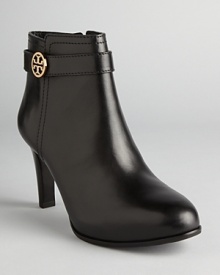 Tory Burch ups the style quotient on the basic bootie in these sleek shoes featuring almond toes, polished leather and elegant logo accents. Tory Burch ups the style quotient on the basic bootie in these sleek shoes featuring almond toes, polished leather and elegant logo accents.