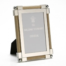 Made entirely from hand, each piece of William Yeoward Crystal draws its inspiration from antique crystal pieces originally made in England during the 18th and early 19th centuries. Traditionally styled and utterly elegant, the Classic Raffia frame is an elegant way to frame your favorite photos. Made entirely from hand, each piece of William Yeoward Crystal draws its inspiration from antique crystal pieces originally made in England during the 18th and early 19th centuries. Traditionally styled and utterly elegant, the Classic Raffia frame is an elegant way to frame your favorite photos.