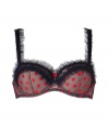 Get the sultry glamorous look of a vintage 1950s pin up girl in Von Follies by Dita Von Teeses black balconette bra, detailed with ruffled mesh trim and fun red embroidered dots - perfect for giving as a saucy holiday gift! - Underwire style with wired sides, lightly padded structured nude cups, ruffled sheer black mesh trim, dotted mesh trim on cups, dotted mesh sides, ruffle detailed thick straps, iconic soft elastic triangle cross back detail, adjustable hook-and-eye closures - Wear with the matching briefs for a seriously seductive look