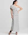 A subtle stripe print floats on the floor-length silhouette of this DKNYC maxi dress. Play up the nautical sentiment with lace-up espadrilles.