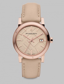 An iconic check stamped dial with a warm rose goldtone stainless steel case and a supple leather strap. Swiss quartz movementWater resistant to 5 ATMRound rose goldtone stainless steel case, 34mm (1.3)Smooth bezelNude check stamped dialBar hour markersDate display at 3 o'clockSecond hand Nude leather strapMade in Switzerland An iconic check stamped dial with a warm rose goldtone stainless steel case and a supple leather strap. Swiss quartz movementWater resistant to 5 ATMRound rose goldtone stainless steel case, 34mm (1.3)Smooth bezelNude check stamped dialBar hour markersDate display at 3 o'clockSecond hand Nude leather strapMade in Switzerland