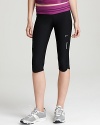 A sleek design with a colorful contrasting waistband, these Nike capri pants boast Dri-FIT technology to wick away moisture.