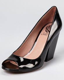 Somewhere in between a block heel and a wedge, this uniquely-heeled pair of VINCE CAMUTO pumps are sleek and shining in patent leather. Somewhere in between a block heel and a wedge, this uniquely-heeled pair of VINCE CAMUTO pumps are sleek and shining in patent leather.