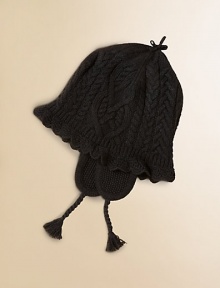 A timeless cable knit hat is luxuriously embellished with pointelle trim and tassels for a cozy style to don during the colder months.Cable-knit constructionPointelle trim at brimEarflaps with braided tassels that tie beneath the chinCotton/WoolHand washImported
