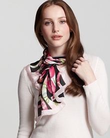 A chic oblong silk scarf with large floral Ganini print all over from Salvatore Ferragamo. A chic oblong silk scarf with large floral Ganini print all over from Salvatore Ferragamo.