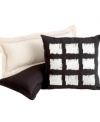 Black, white and stylish all over, the Brushstroke decorative pillow from Echo channels modern art with a geometric grid design of embroidered squares.