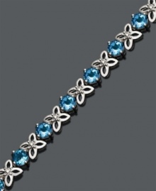 Sweeten your look for spring. Bracelet features round-cut blue topaz (9-1/2 ct. t.w.) and sterling silver flowers accented by sparkling diamonds. Approximate length: 7 inches. Sweeten your look for spring. Bracelet features round-cut blue topaz (9-1/2 ct. t.w.) and sterling silver flowers accented by sparkling diamonds. Approximate length: 7 inches.