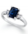 A subtle touch of blue. This vibrant 14k white gold ring features an emerald-cut sapphire (1-1/10 ct. t.w.) and round-cut diamond side stones (1/5 ct. t.w.).