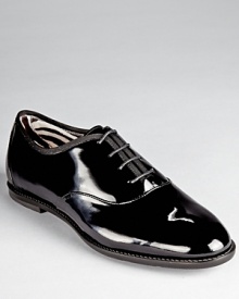 A tap dance inspired silhouette from Salvatore Ferragamo looks smart in glossy patent leather. A zebra print lining adds a playful touch. A tap dance inspired silhouette from Salvatore Ferragamo looks smart in glossy patent leather. A zebra print lining adds a playful touch.