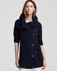 Perfect for the minimalist at heart, this Burberry Brit jacket features an easy A-line silhouette and classic hardware. A roll-up hood tucks into the collar for a utilitarian-chic finish. Perfect for the minimalist at heart, this Burberry Brit jacket features an easy A-line silhouette and classic hardware. A roll-up hood tucks into the collar for a utilitarian-chic finish.