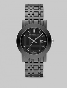 A sleek design with a black check etched dial. Quartz movement Water resistant to 5 ATM Round ion-plated stainless steel case, 34mm (1.3) Smooth bezel Black dial Bar hour markers Date display at 3 o'clock Second hand Ceramic check link bracelet, 18mm wide (0.7) Made in Switzerland A sleek design with a black check etched dial. Quartz movement Water resistant to 5 ATM Round ion-plated stainless steel case, 34mm (1.3) Smooth bezel Black dial Bar hour markers Date display at 3 o'clock Second hand Ceramic check link bracelet, 18mm wide (0.7) Made in Switzerland
