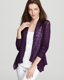 A sheer purple fabric takes to an elegant waterfall hem for a refined version of the classic Eileen Fisher cardigan. A sheer purple fabric takes to an elegant waterfall hem for a refined version of the classic Eileen Fisher cardigan.