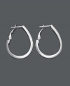 Give your old earrings the heave-ho. Try hoops that offer an extra kick. Crafted in sterling silver, these oval-shaped hoop earrings feature a unique flat-edge design. Approximate diameter: 1-1/4 inches.