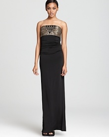 This Laundry by Shelli Segal dress makes a statuesque appearance in a strapless column silhouette, detailed with metallic and jeweled accents. This Laundry by Shelli Segal dress makes a statuesque appearance in a strapless column silhouette, detailed with metallic and jeweled accents.