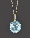 Sparkling pavé diamonds and a sky blue topaz are set in 18K yellow gold.