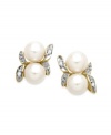 A natural choice. These earrings, crafted from 10k gold, exudes elegance with cultured freshwater pearls (5 mm) and diamond accents along a whimsical leaf motif. Approximate drop: 5/8 inch. Approximate width: 1/3 inch